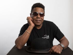 Tito Jackson, a member of the famed Jackson 5, poses for a portrait in Los Angeles, July 24, 2019, to promote his solo project, a new version of his 2017 song "One Way Street." (Photo by Mark Von Holden/Invision/AP, File).