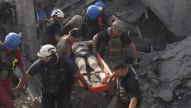 Rescuers carry a wounded man after Russian missile attack on the city palace of sports in Kharkiv, Ukraine, Sunday, Sept. 1, 2024. Over 40 civilians were injured in Sunday's missile attack. (AP Photo/Andrii Marienko).