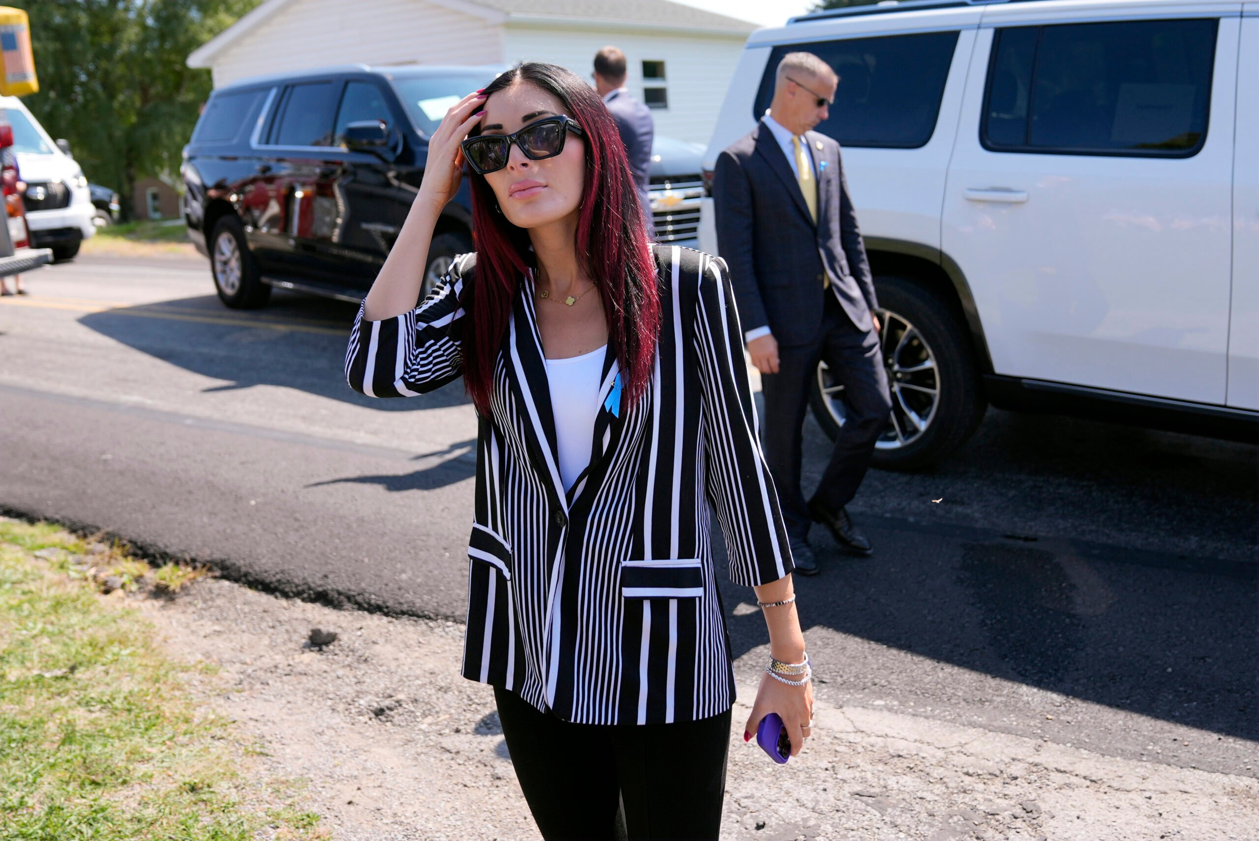 Laura Loomer arrives with Republican presidential nominee former President Donald Trump for a visit to the Shanksville Volunteer Fire Company in Shanksville, Pa., Wednesday, Sept. 11, 2024. (AP Photo/Matt Rourke).