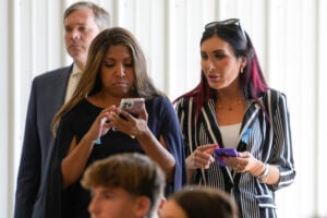 Lynne Patton and Laura Loomer watch as Republican presidential nominee former President Donald Trump visits the Shanksville Volunteer Fire Company in Shanksville, Pa., Wednesday, Sept. 11, 2024. (AP Photo/Matt Rourke).