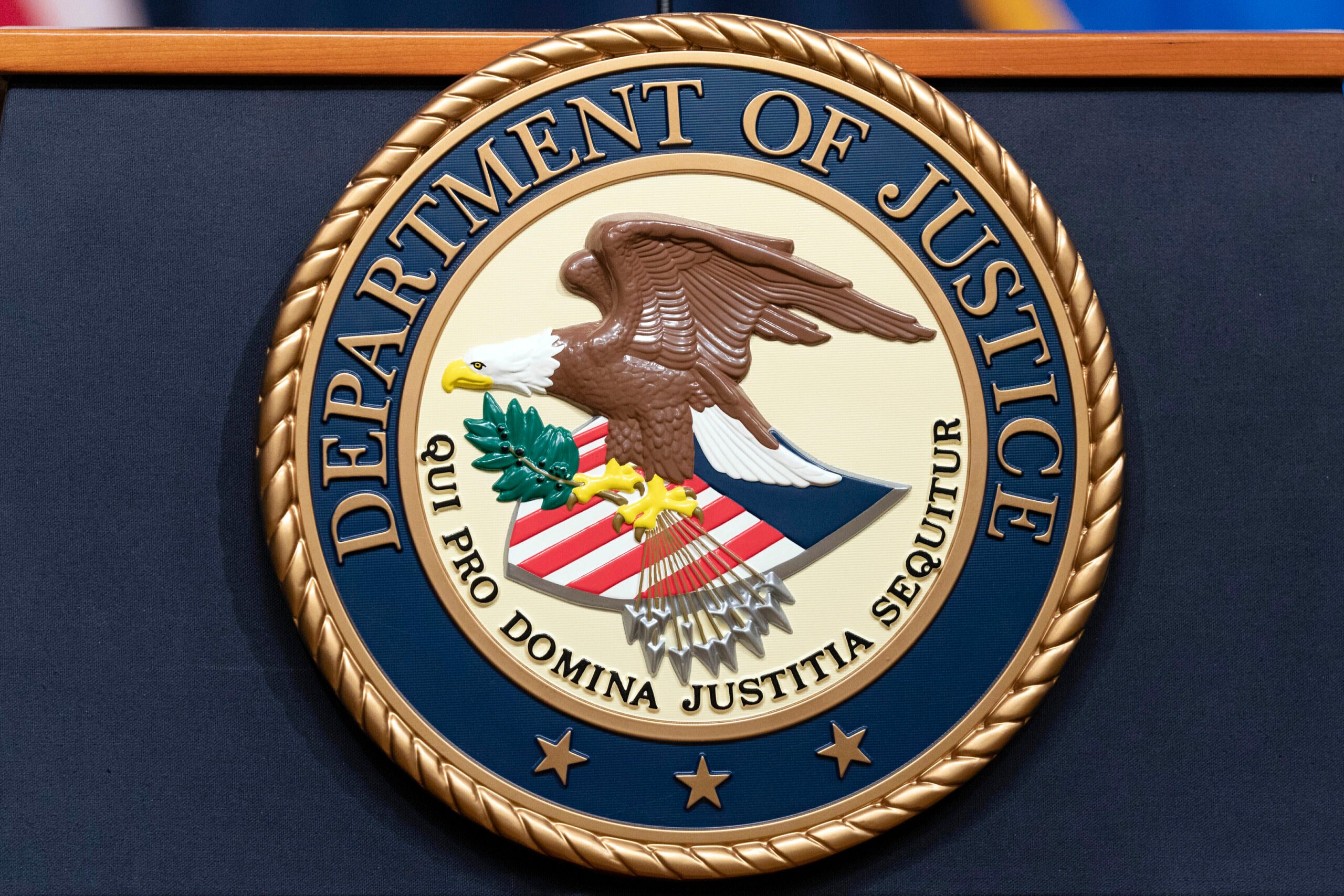 The Department of Justice seals is seen during a news conference at the DOJ office in Washington, May 16, 2023. (AP Photo/Jose Luis Magana, File).