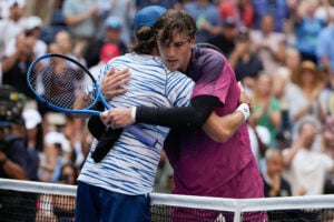 Jack Draper, of Great Britain, right, hugs Alex de Minaur, of Australia, after winning their quarterfinal match of the U.S. Open tennis championships, Wednesday, Sept. 4, 2024, in New York. (AP Photo/Pamela Smith).