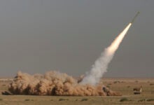 In this photo released by the Iranian semi-official Fars News Agency, Revolutionary Guard's Fateh missile is launched in a drill near the city of Qom, 80 miles (130 kilometers) south of the capital Tehran, Iran, Sept. 27, 2009. (Ali Shaigan/Fars News Agency via AP File).