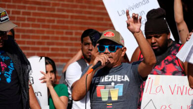 Resident Moises Didenot speaks during a rally staged by the East Colfax Community Collective to address chronic problems in the apartment buildings occupied by people displaced from their home countries in central and South America Tuesday, Sept. 3, 2024, in Aurora, Colo. (AP Photo/David Zalubowski).