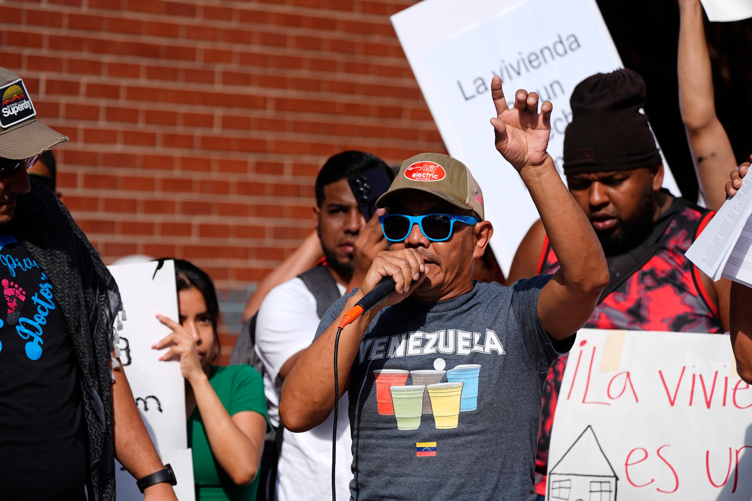 Resident Moises Didenot speaks during a rally staged by the East Colfax Community Collective to address chronic problems in the apartment buildings occupied by people displaced from their home countries in central and South America Tuesday, Sept. 3, 2024, in Aurora, Colo. (AP Photo/David Zalubowski).