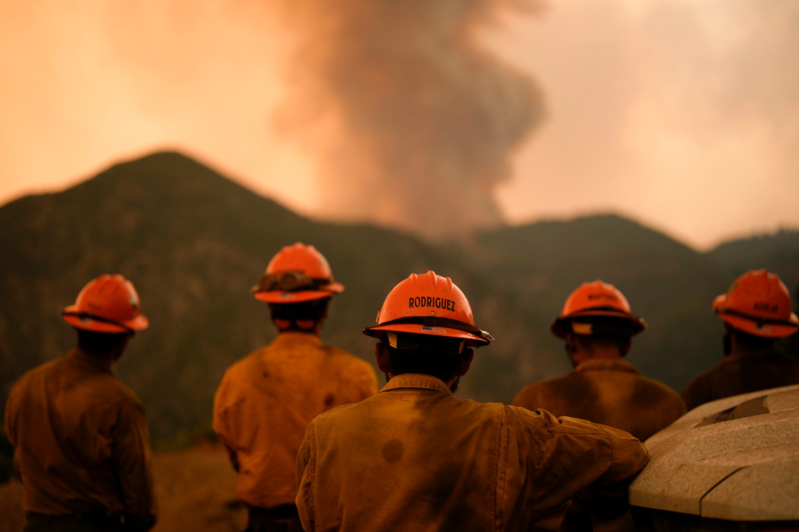 Members of the Mill Creek Hotshots monitor the Line Fire Monday, Sept. 9, 2024, near Angelus Oaks, Calif. (AP Photo/Gregory Bull).