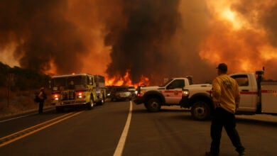 Firefighters monitor the Airport Fire as it advances Tuesday, Sept. 10, 2024, in El Cariso, an unincorporated community in Riverside County, Calif. (AP Photo/Eric Thayer).