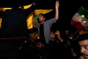 Demonstrators celebrate Iran's missile strike against Israel during a gathering in front of the British Embassy in Tehran, Iran, Tuesday, Oct. 1, 2024. (AP Photo/Vahid Salemi).