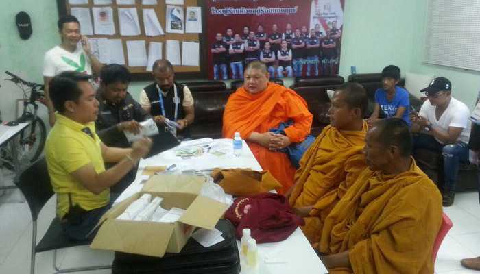 Two men nabbed in Phuket for posing as monks, begging for “alms’