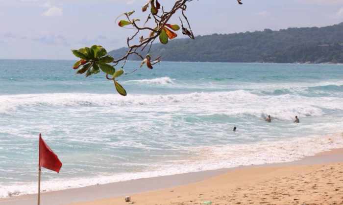 Phuket Governor cleans Karon Beach, urges beachgoers to obey red flags