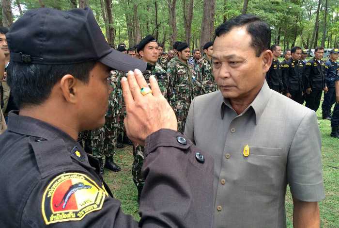 Reinforced by Thai military, Phuket park chief decides to stay