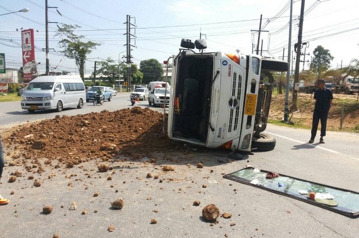 Phuket tyre blowout throws driver, flips truck and dumps load