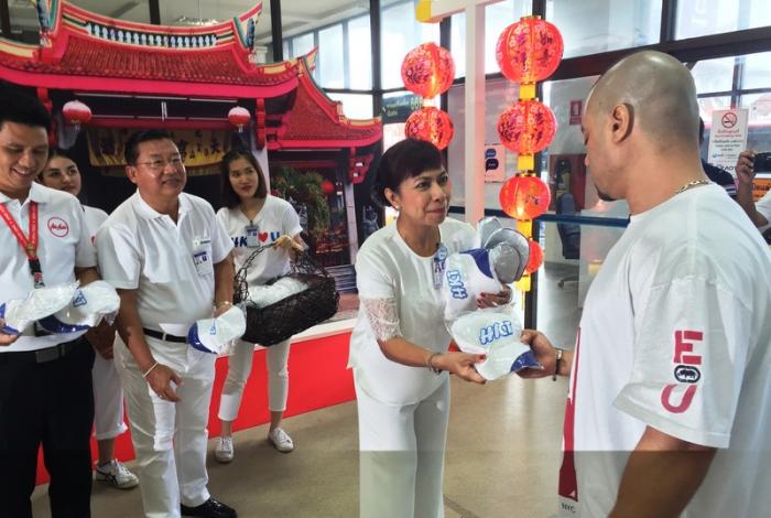 Airport staff welcome festival arrivals