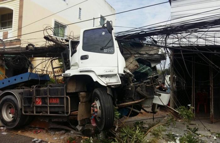 Two injured as truck crashes into utility pole in Phuket