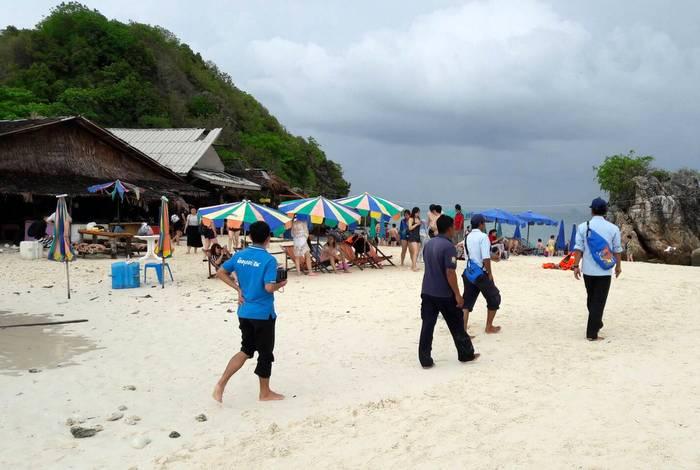 Tourist arrested for feeding fish