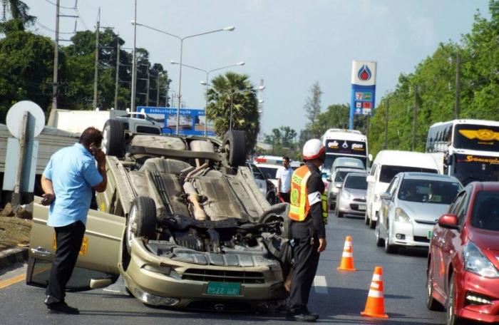 Taxi flips on main Phuket thoroughfare