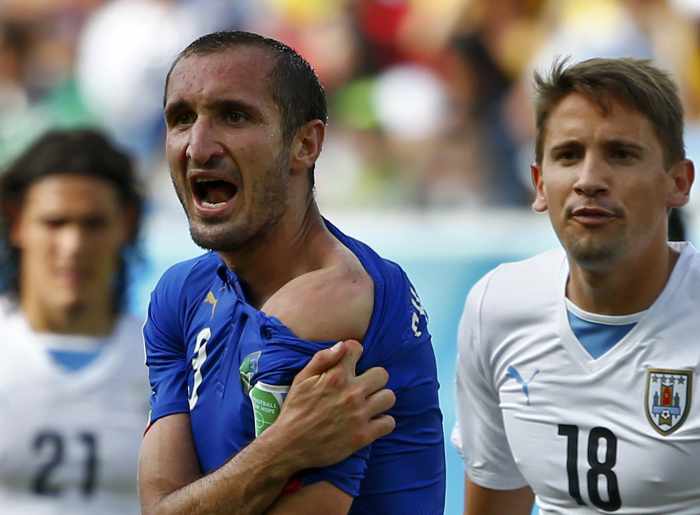 Suarez faces another ban after biting Italian defender