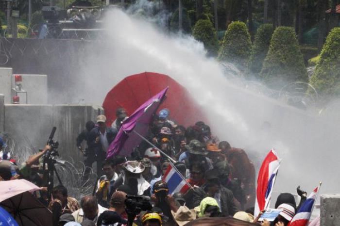 Water, tear gas fired on protesters in Bangkok