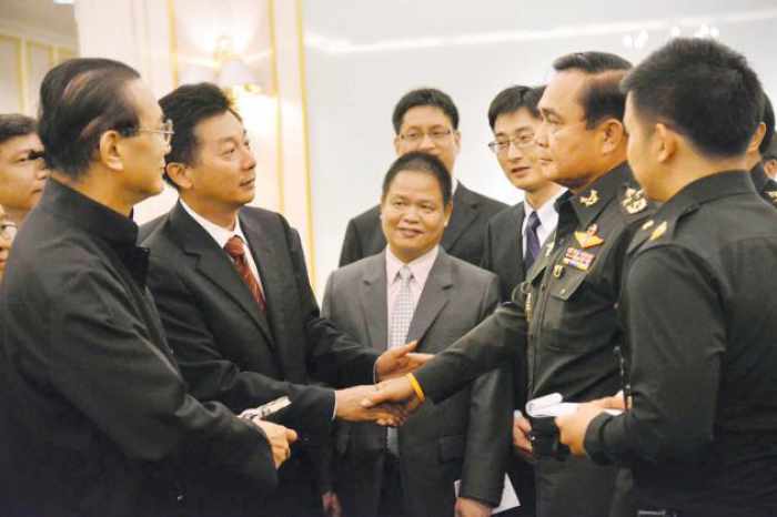 Junta woos Chinese; vows interim government within three months