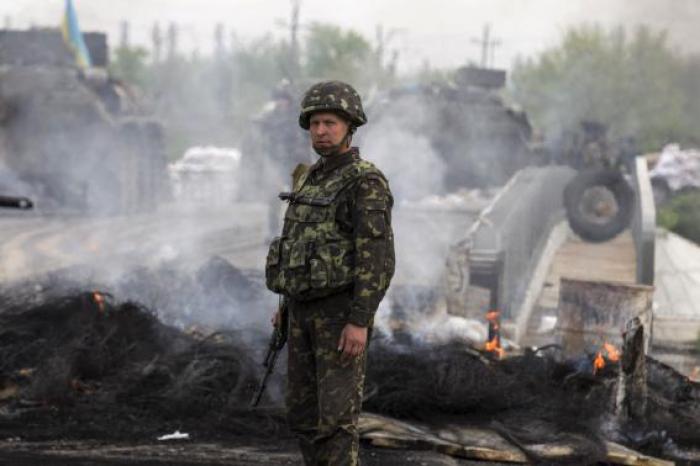 Ukraine attacks rebel city, helicopter shot down