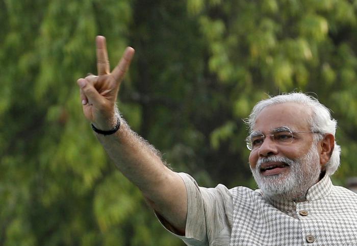 Victorious Modi fights tears in first address to India parliament