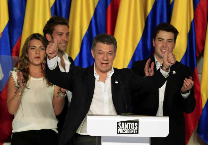 Colombia’s Santos wins re-election, to push on with peace talks