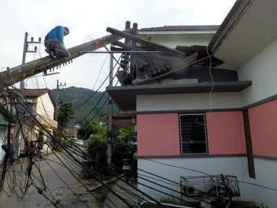 Burst water main topples power pole in Phuket