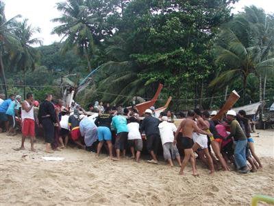 Longtail boats run aground at Bang Tao Bay, Phuket