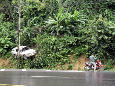 Power pole pins car to Phuket hillside