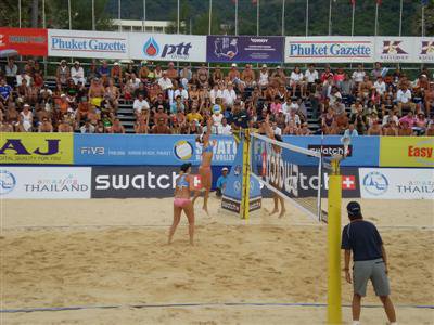 Volleyball vixens smashing balls on the beach