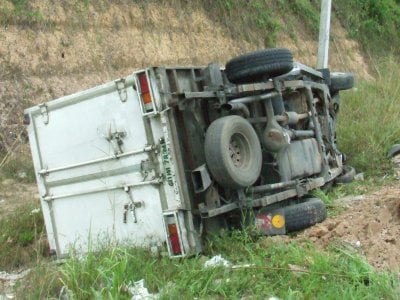 Bike in wrong lane causes Phuket truck flip