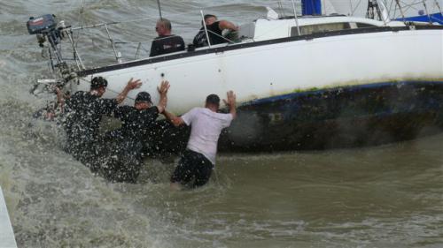 Phuket yachties in dramatic boat rescue from sea wall