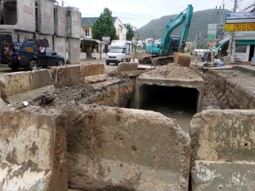 Gaping hole in Patong street blocked off, partially filled