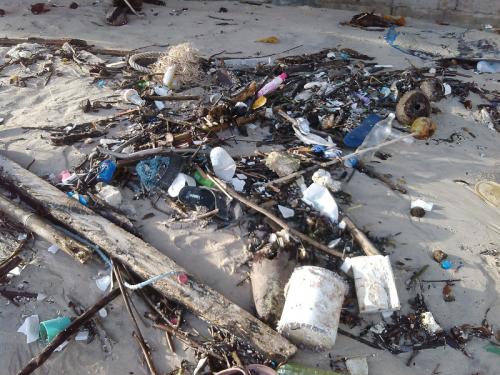 Monsoon weather brings trash to Phuket shore