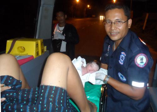 On roadside north of Phuket, stomachache turns into baby boy