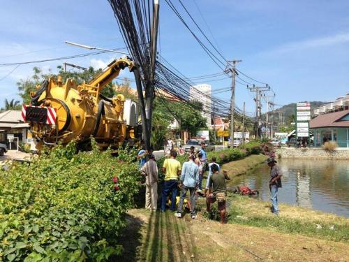 Phuket pond cleanup uncovers dumped motorbike