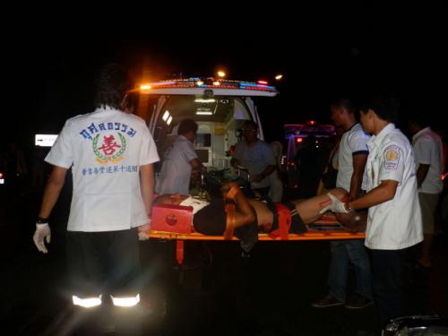 Phuket motorcyclist survives slide under chicken truck