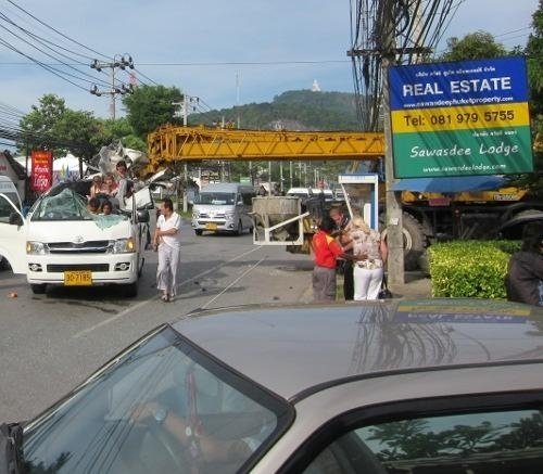 Crane rips roof off Phuket tour van