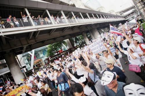 Phuket Gazette Thailand News: White masks rally; Democrats win Don Mueang; Monks and supercars; Crime re-enactments under the gun