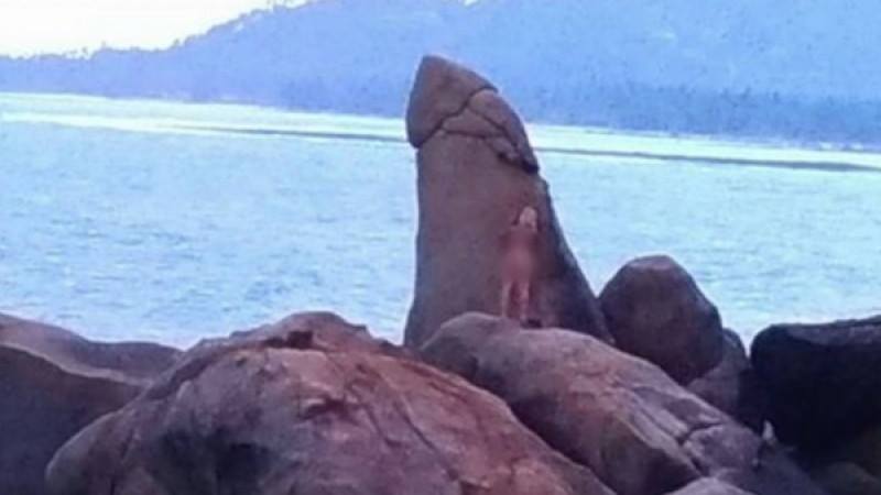 Naked tourist hugs a rock in Samui. But not just any rock!