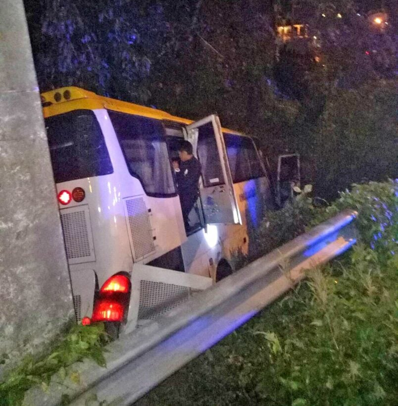 Tour bus drives over Kata Hill roadside