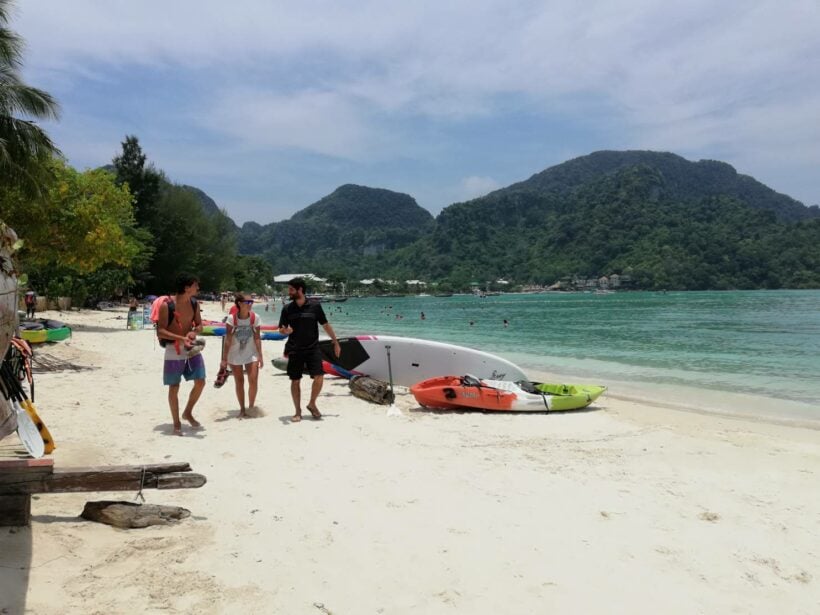 Kayak and tour ad signs on Koh Phi Phi being moved off the beaches