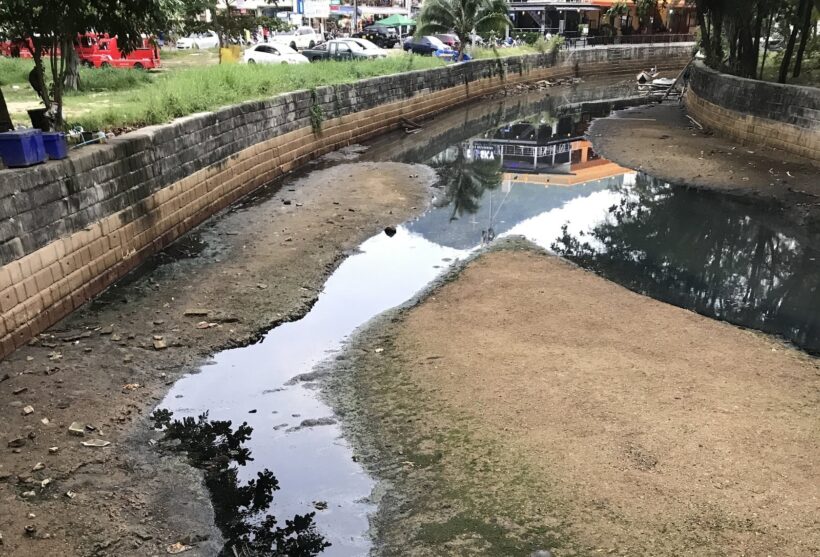 Black water flowing freely onto Kamala beach