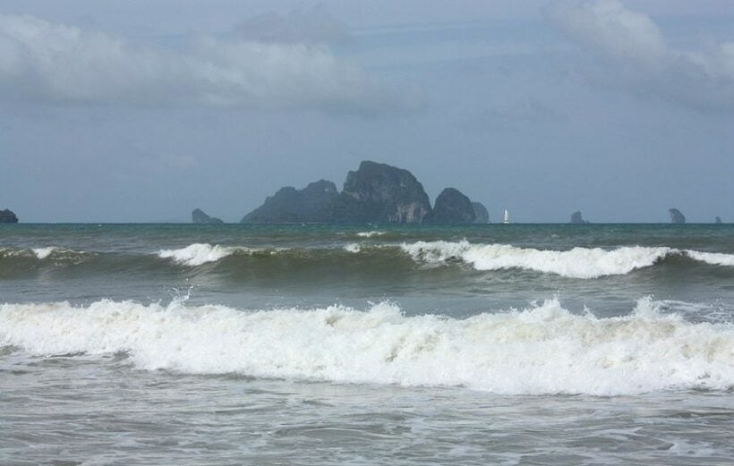 Officials raising the yellow flags on Krabi beaches