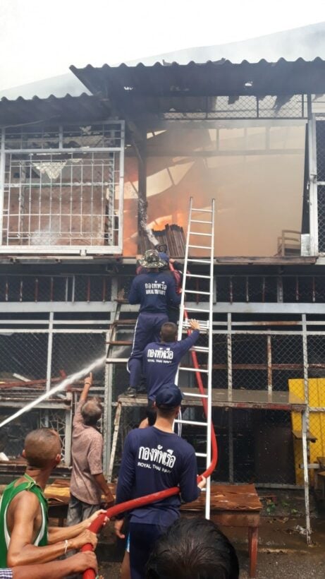 Navy officers assist putting out the Phuket furniture warehouse fire