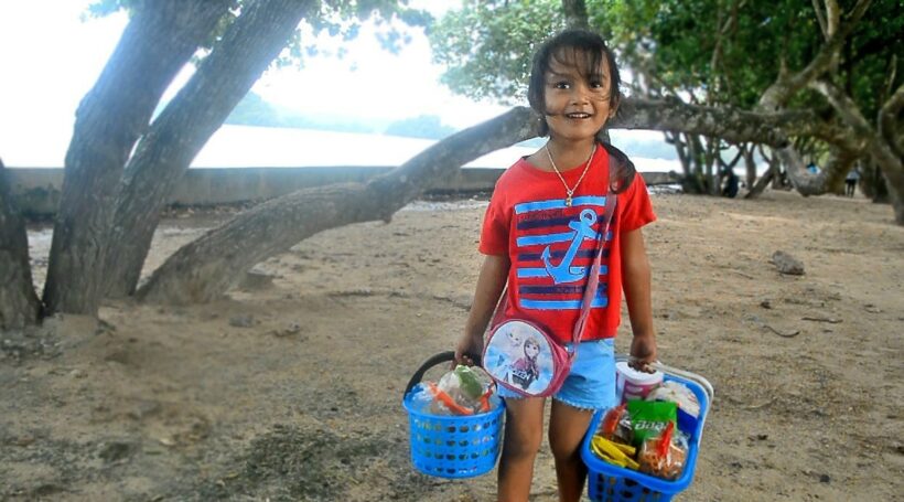 Fern helps her mum sell food in Krabi. She also speaks four languages fluently.