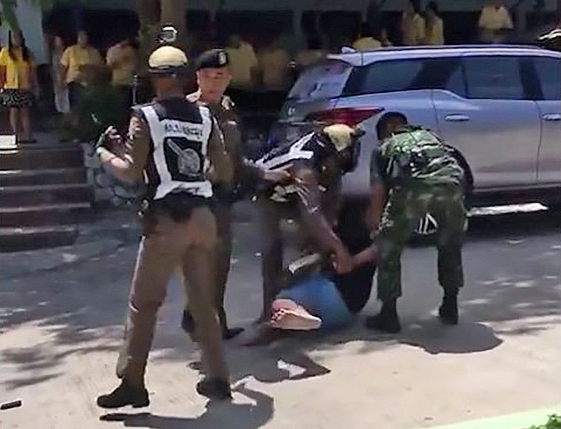 Police drag man out of Pattaya school after ex-wife clams he was carrying a gun