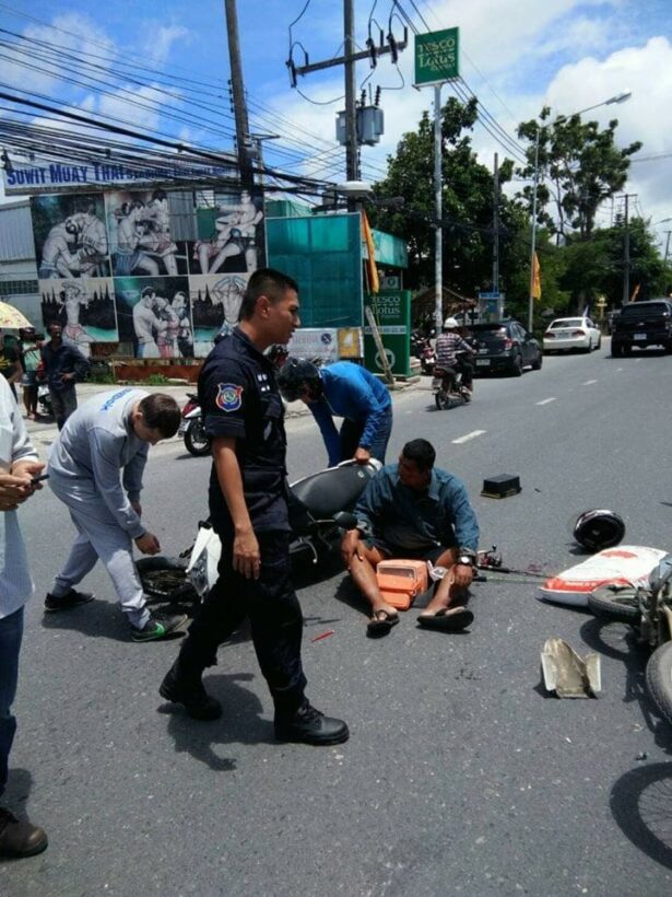 Phuket Tourist Police stop to help at a road accident