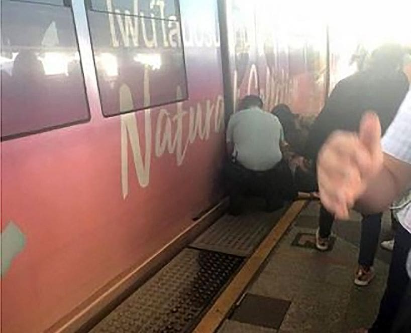 Woman faints and falls, hitting Bangkok BTS train this morning