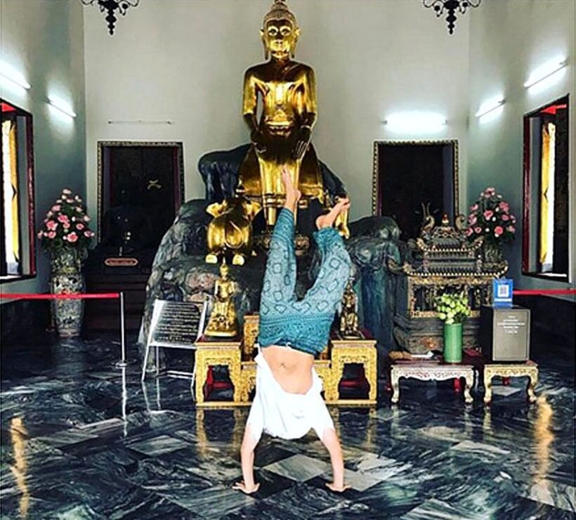 Instagrammer apologises for doing handstand at Wat Pho